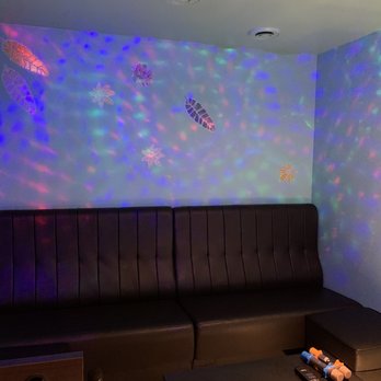 Solo Karaoke - a couch and a table in a room - Karaoke Near Me - Burnaby, British Columbia