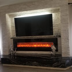 Neptune Electric - Fire place with tv and backlight all wired up by Neptune electric
