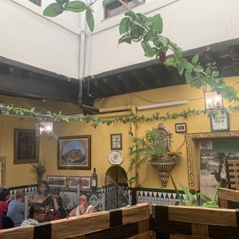 Lo Nuestro - Restaurant seating area (formerly a Jewish house) - Spanish Near Me - Toledo, TO