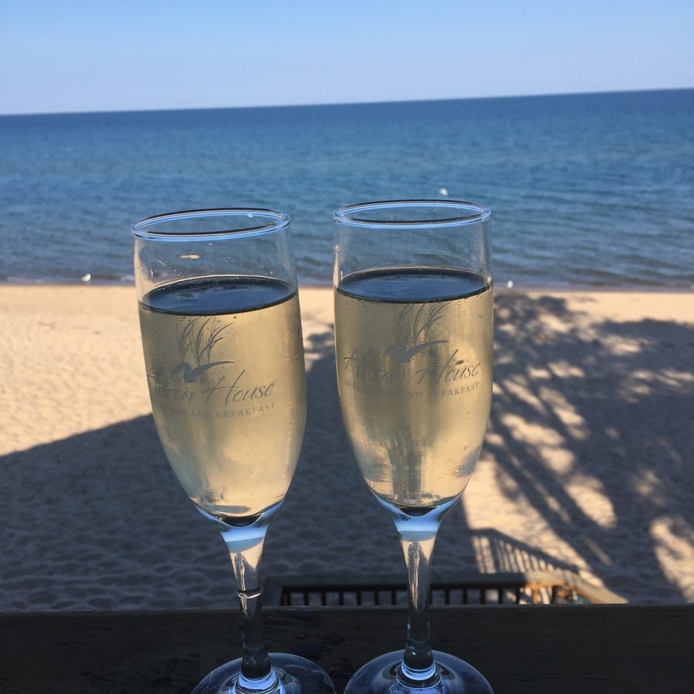 Huron House Bed & Breakfast - A glass of wine from the deck overlooking Lake Huron - Bed & Breakfast Near Me - Oscoda, Michigan Huron House Bed & Breakfast - A glass of wine from the deck overlooking Lake Huron - Bed & Breakfast Near Me - Oscoda, Michigan