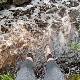 Hanging over the edge. Very scary and dangerous