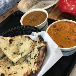 Curry club chicken (legit), butter chicken, half portions. Garlic naan Curry club chicken (legit), butter chicken, half portions. Garlic naan