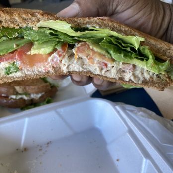 Tortas Oasis - a hand holding a sandwich - Sandwiches Near Me - National City, California