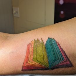Open book with rainbow colored pages. Open book with rainbow colored pages.