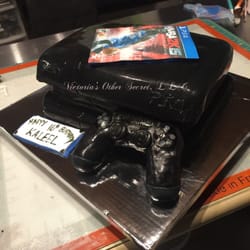 Victoria’s Other Secret - Ps4 cake with edible remote and game.