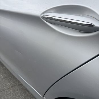 My Dent Guy - Before.  Scratch and dent in the middle of the door and bulge below door handle - Mobile Dent Repair Near Me