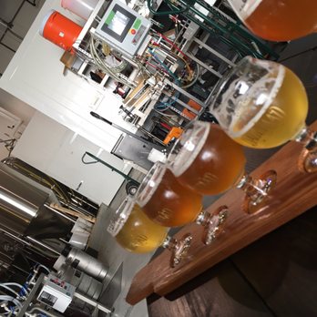 Dageraad Brewing - Tasty flight, backdrop is where the magic happens. - Breweries Near Me - Burnaby, British Columbia