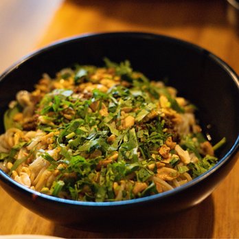 Lao Peng You - a bowl of food on a table - Chinese Near Me - Chicago, Illinois