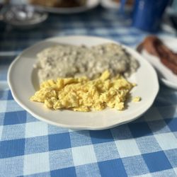 Kelly's Cafe - Biscuits and sausage gravy with a side of bacon