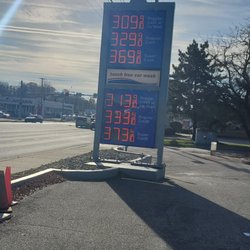 Carroll Fuel - Price with cash & a car wash in fine print?  No other station I've come across in the country publishes a cash price with a car wash.