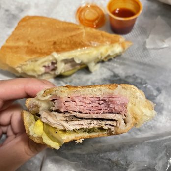 El Cubanito - Hot sauce, Cuban lechón sandwich, with pickles mustard pork and ham. - Cuban Near Me - Chicago, Illinois El Cubanito - Hot sauce, Cuban lechón sandwich, with pickles mustard pork and ham. - Cuban Near Me - Chicago, Illinois