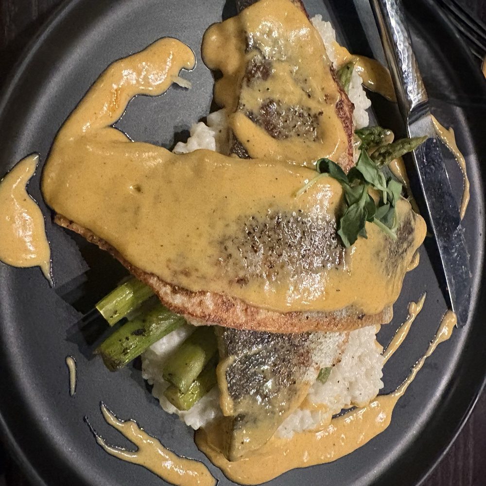 Victors - Blackened fish and grits with hollandaise sauce special - New American Near Me - Florence, South Carolina Victors - Blackened fish and grits with hollandaise sauce special - New American Near Me - Florence, South Carolina