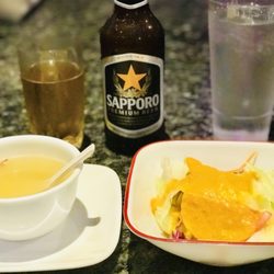 Tai Show Hibachi - A Sapporo Authentic Japanese Beer with A Frosted Glass, Chicken Noodle Soup, & A Ginger Dressing Salad to Start it Off.