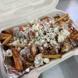 Best Spuds Gourmet French Fries - Buffalo Bleus! Hand-breaded chicken tenders, hot sauce, house made ranch, bleu cheese crumbles.