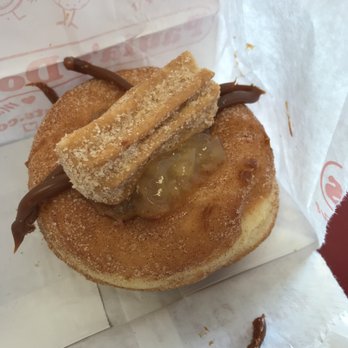 Paula's Donuts - Churro donut - the dulce de leche stuck to the wrapper. - Donuts Near Me - Tonawanda, New York Paula's Donuts - Churro donut - the dulce de leche stuck to the wrapper. - Donuts Near Me - Tonawanda, New York