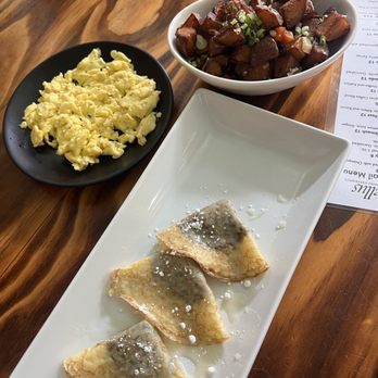 Novellus - Cinnamon roll crepes, paid separate for the side of eggs and potatoes. - New American Near Me - Saint Charles, Missouri