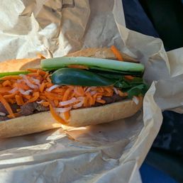 Grilled pork banh mi with fried egg Grilled pork banh mi with fried egg