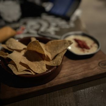 Three Bridges Bar & Grill - Chips and queso con chorizo - Bars Near Me - Orlando, Florida