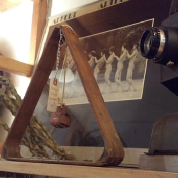 Moon + Arrow - Antique billiards accessories juxtaposed with an old film projector. - Home Decor Near Me - Philadelphia, Pennsylvania