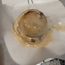 Cinnamon bun after reheating and adding icing (see my pro tip in review)! 10/10