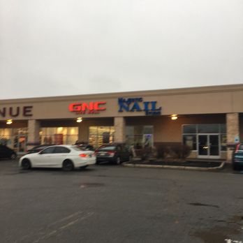 GNC - a car parked in front of a store - Vitamins & Supplements Near Me - Linden, New Jersey