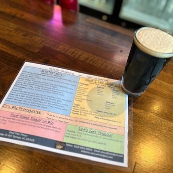 Vinyl Pies - a pint of beer on a table - Pizza Near Me - Hot Springs, North Carolina
