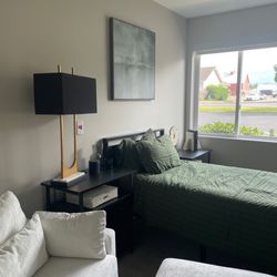 This photo shows one of our staged rooms which has been updated with new flooring, carpet, paint and lighting.