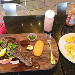 Steak and egg breakfast with watermelon juice