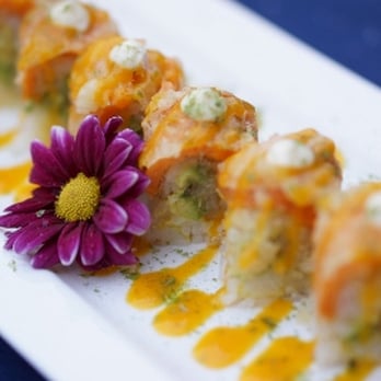 Sushi Kui - a plate of sushi with a flower - Sushi Bars Near Me - Aurora, Ontario