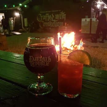 Emerald Republic Brewing - In the biergarten enjoying our Peanut butter stout and Skittles cocktail created for the Halloween event by the fire pit. - Breweries Near Me - Pensacola, Florida