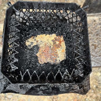 Ultimate Chimney Sweep - Chimney cap caked with creosote from a woodstove flue - Chimney Sweeps Near Me - Bellingham, Massachusetts Ultimate Chimney Sweep - Chimney cap caked with creosote from a woodstove flue - Chimney Sweeps Near Me - Bellingham, Massachusetts