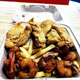 chicken and fries in a styrofoam container chicken and fries in a styrofoam container