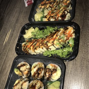 Sake Sushi - Salmon roll (bottom), Dynamite Roll (middle), and Godzilla roll (top) - Japanese Near Me - Brooklyn, New York