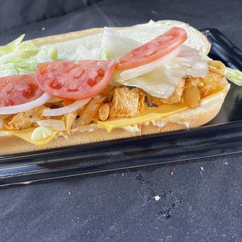 Pizza Pleasers - a chicken sandwich with lettuce and tomatoes - Pizza Near Me - Halethorpe, Maryland Pizza Pleasers - a chicken sandwich with lettuce and tomatoes - Pizza Near Me - Halethorpe, Maryland