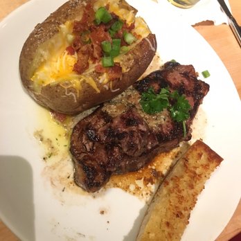 Jackson Square Grill - New York Strip with loaded baked potato - Seafood Near Me - Columbus, Mississippi