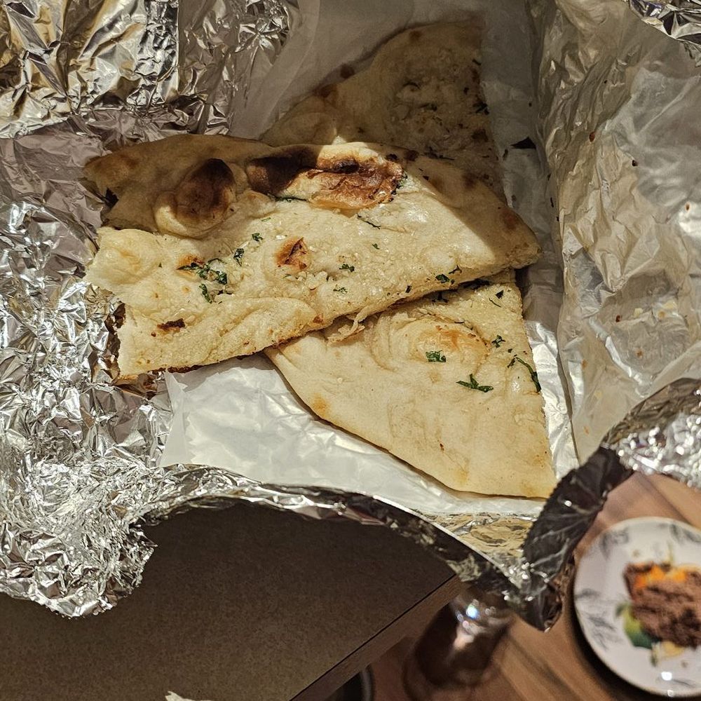 2 pieces of garlic Naan for $4 2 pieces of garlic Naan for $4