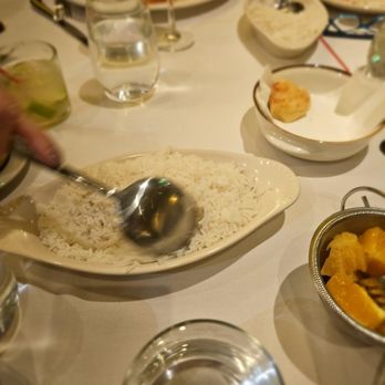 Via Brasil Restaurant - Rice with feijoada and other dishes. A pão de queijo in back - Brazilian Near Me - New York, New York Via Brasil Restaurant - Rice with feijoada and other dishes. A pão de queijo in back - Brazilian Near Me - New York, New York