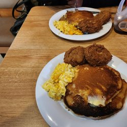 Hunter's Cafe - Pancakes scramble eggs with onion and cheese and two salmon cakes