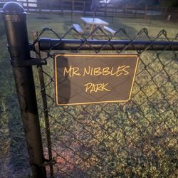 Hilltop RV Park - New dog park w/ picnic table and umbrella.