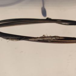 The Bike Shop - My badly frayed rear derailleur cable. It jammed solid and no shifting was possible.