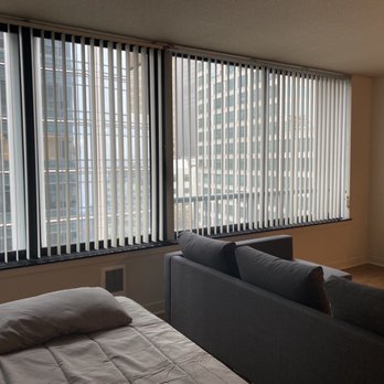 Harbor Steps Apartments - Picture windows. The middle window opens up. - Apartments Near Me - Seattle, Washington Harbor Steps Apartments - Picture windows. The middle window opens up. - Apartments Near Me - Seattle, Washington