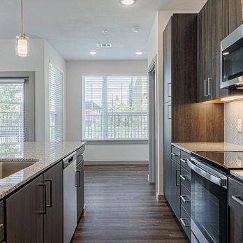 Leasing Solutions - Beautiful gallery kitchen with lots of light - Apartments Near Me - Houston, Texas