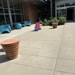 West Regional Library - Outdoor seating area with a game