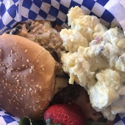 Yummy mushroom burger with potato salad. Yummy mushroom burger with potato salad.
