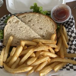 Meraki Restaurant - Buffalo chicken sandwich on sourdough with fries
