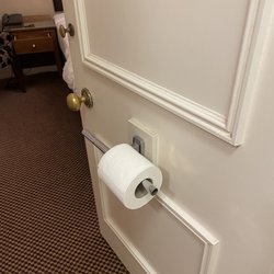 Toilet paper on the door, so slid off as I walked by, every time