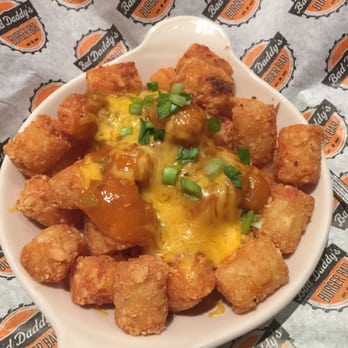 Bad Daddy's Burger Bar - Tots with green chili and cheese.  Good flavor.  Some burnt tots in there though. - Burgers Near Me - Centennial, Colorado