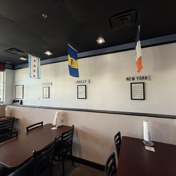 Tri City Eatery - Interior seating with themed decor - Sandwiches Near Me - Fort Myers, Florida Tri City Eatery - Interior seating with themed decor - Sandwiches Near Me - Fort Myers, Florida