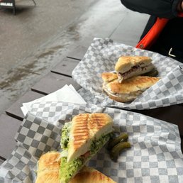two sandwiches on a table two sandwiches on a table