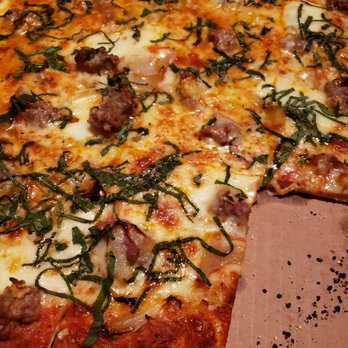 Victory Tap Chicago - Thin crust with sausage, garlic, onions, and basil. (Notice the burnt particles?) - Bars Near Me - Chicago, Illinois